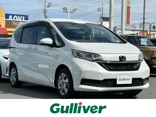 ホンダ フリード ハイブリット G ホンダセンシング 群馬県 2020(令2)年 2.6万km プラチナホワイトパール 純正ナビ(VXM-204VFi)/CD・DVD・SD・USB/Bluetooth・フルセグTV/バックカメラ/両側パワースライドドア/ビルトインETC/前席シートヒーター/クルーズコントロール/ワイパーデアイサー/横滑り防止装置/レーンキープアシスト/衝突軽減ブレーキ/アイドリングストップ/純正フロアマット/取説・保証書/スマートキー×2