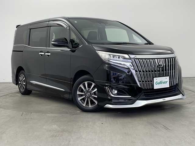 トヨタ エスクァイア Gi 兵庫県 2018(平30)年 8万km ブラック ・ワンオーナー車/・純正9インチナビ/・Bluetooth/フルセグテレビ/DVD/CD/SD/USB/・バックカメラ/・Toyota Safety Sense/・プリクラッシュセーフティ/・レーンディパーチャーアラート/・オートマチックハイビーム/・先行車発進告知機能/・アイドリングストップ/・横滑り防止装置/・S-VSC/・クルーズコントロール/・純正12.1インチリアフリップダウンモニター/・両側パワースライドドア/・レザーシート/・シートヒーター/・シートリフター/・リアオートエアコン/・純正フロアマット/・ステアリングリモコン/・純正15インチアルミホイール/・LEDオートライト/・フォグランプ/・モデリスタエアロ/・ビルドインETC