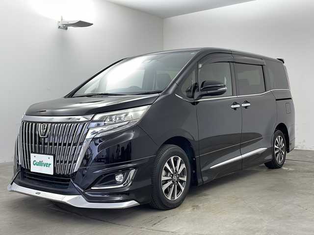 トヨタ エスクァイア Gi 兵庫県 2018(平30)年 8万km ブラック ・ワンオーナー車/・純正9インチナビ/・Bluetooth/フルセグテレビ/DVD/CD/SD/USB/・バックカメラ/・Toyota Safety Sense/・プリクラッシュセーフティ/・レーンディパーチャーアラート/・オートマチックハイビーム/・先行車発進告知機能/・アイドリングストップ/・横滑り防止装置/・S-VSC/・クルーズコントロール/・純正12.1インチリアフリップダウンモニター/・両側パワースライドドア/・レザーシート/・シートヒーター/・シートリフター/・リアオートエアコン/・純正フロアマット/・ステアリングリモコン/・純正15インチアルミホイール/・LEDオートライト/・フォグランプ/・モデリスタエアロ/・ビルドインETC