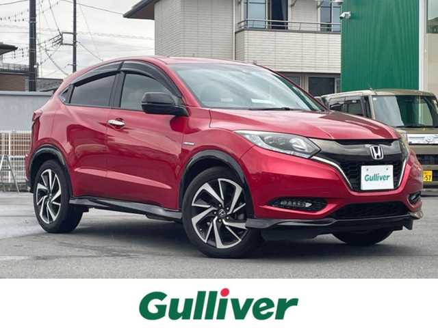 ホンダ ヴェゼル ハイブリッド RS ホンダセンシング 静岡県 2017(平29)年 7.1万km プレミアムクリスタルレッドM 純正SDナビ（ワンセグTV、バックカメラ、DVS再生機能、CDチェンジャー、BT）/ホンダセンシング/バックカメラ/クルーズコントロール/パドルシフト/D＋N席シートヒーター/合皮シート/純正フロアマット/純正アルミホイール/オートエアコン/ABS/オートライト/レーンキープアシスト/横滑り防止装置/衝突軽減システム/パワーウィンドウ/パワーステアリング