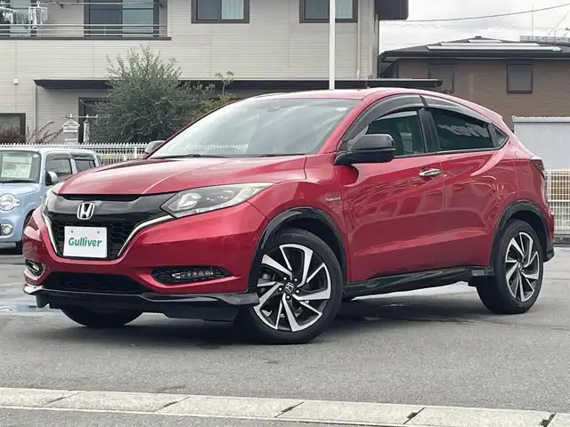 ホンダ ヴェゼル ハイブリッド RS ホンダセンシング 静岡県 2017(平29)年 7.1万km プレミアムクリスタルレッドM 純正SDナビ（ワンセグTV、バックカメラ、DVS再生機能、CDチェンジャー、BT）/ホンダセンシング/バックカメラ/クルーズコントロール/パドルシフト/D＋N席シートヒーター/合皮シート/純正フロアマット/純正アルミホイール/オートエアコン/ABS/オートライト/レーンキープアシスト/横滑り防止装置/衝突軽減システム/パワーウィンドウ/パワーステアリング