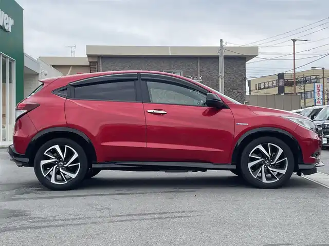 ホンダ ヴェゼル ハイブリッド RS ホンダセンシング 静岡県 2017(平29)年 7.1万km プレミアムクリスタルレッドM 純正SDナビ（ワンセグTV、バックカメラ、DVS再生機能、CDチェンジャー、BT）/ホンダセンシング/バックカメラ/クルーズコントロール/パドルシフト/D＋N席シートヒーター/合皮シート/純正フロアマット/純正アルミホイール/オートエアコン/ABS/オートライト/レーンキープアシスト/横滑り防止装置/衝突軽減システム/パワーウィンドウ/パワーステアリング