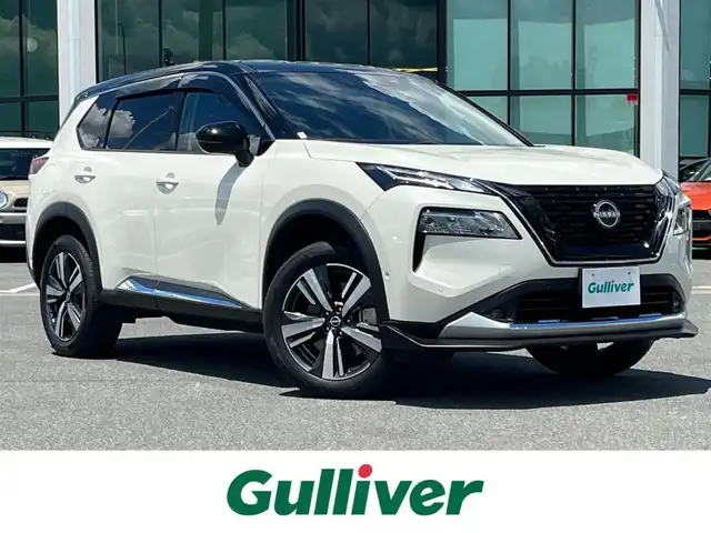 日産 エクストレイル G e－4ORCE 奈良県 2023(令5)年 7.6万km ブリリアントホワイトパール/スーパーブラック 2トーン NISMOフロントリップ/純正ナビ(フルセグTV/AM・FM/BT/USB/AppleCarPlay)/アラウンドビューモニター/ビルトインETC2.0/デジタルインナーミラー/ステアリングヒーター/前席パワーシート/前席シートヒーター/プロパイロット/インテリジェントエマージェンシーブレーキ/インテリジェントFCW(前方衝突予測警報)/クルーズコントロール/アダプティブLEDヘッドライトシステム/置くだけ充電/オートブレーキホールド/純正19インチアルミホイール/純正フロアマット