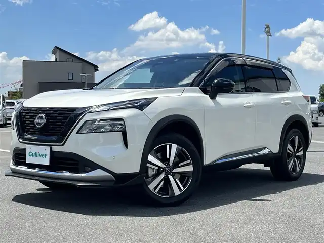 日産 エクストレイル G e－4ORCE 奈良県 2023(令5)年 7.6万km ブリリアントホワイトパール/スーパーブラック 2トーン NISMOフロントリップ/純正ナビ(フルセグTV/AM・FM/BT/USB/AppleCarPlay)/アラウンドビューモニター/ビルトインETC2.0/デジタルインナーミラー/ステアリングヒーター/前席パワーシート/前席シートヒーター/プロパイロット/インテリジェントエマージェンシーブレーキ/インテリジェントFCW(前方衝突予測警報)/クルーズコントロール/アダプティブLEDヘッドライトシステム/置くだけ充電/オートブレーキホールド/純正19インチアルミホイール/純正フロアマット
