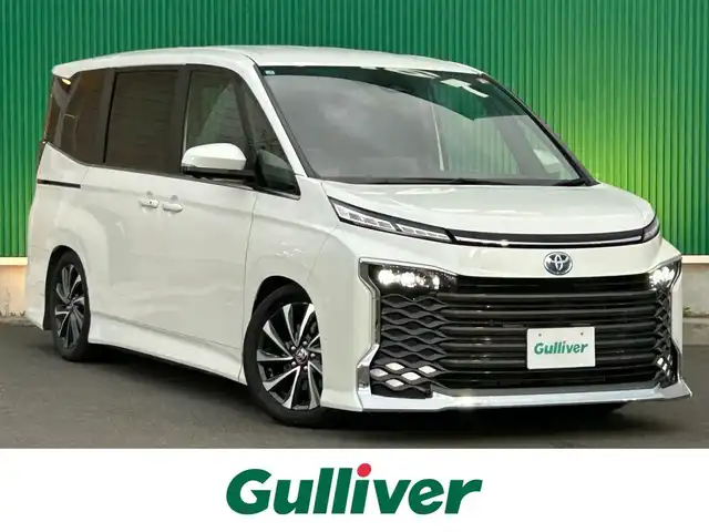 トヨタ ヴォクシー ハイブリッド S－Z 宮城県 2025(令7)年 0.5万km ホワイトパールクリスタルシャイン ディスプレイオーディオプラス/・コネクティッドナビ対応10.5インチディスプレイオーディオ/・車載メモリーナビ/・CD/DVD/・地デジTV/・USB/HDMI/・AppleCarPlay/AndroidAuto/・ETC2.0/トヨタチームメイト/・アドバンストパーク/・パーキングサポートブレーキ（周囲静止物/後方歩行者）/・パノラミックビューモニター/・エレクトロシフトマチック/プロジェクター式LEDヘッドランプ/デイライト/アダプティブハイビームシステム/寒冷地仕様/＝＝＝/BLITZ車高調/セーフティセンス/・プリクラッシュセーフティ/・レーントレーシングアシスト/・レーンディパーチャーアラート/・レーダークルーズコントロール/・オートマチックハイビーム/・ロードサインアシスト/・ドライバー異常時対応システム/・プロアクティブドライビングアシスト/・発進遅れ告知機能/パーキングサポートブレーキ（前後方静止物）/AC100V/1500W/両側パワースライドドア/ハーフレザー/シートヒーター/電動パーキングブレーキ/ブレーキホールド/純正17インチAW/W/サイド/カーテンエアバッグ