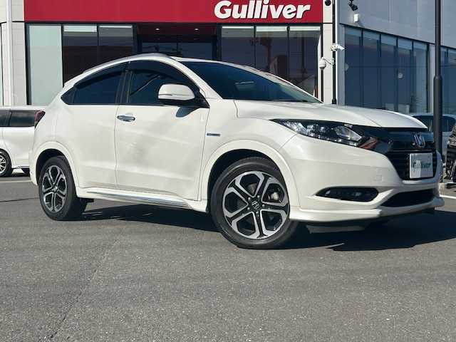 ホンダ ヴェゼル ハイブリッド Z ホンダセンシング 宮城県 2017(平29)年 4.5万km ホワイトオーキッドパール 登録時走行距離44129km/純正SDナビ/AM・FM・TV・Bluetooth・CD・DVD/バックカメラ/デュアルエアコン/クルーズコントロール（追従有）/衝突軽減システム/レーンキープアシスト/ETC/シートヒーター（D＋N席）/ワイパーデアイサー/プッシュスタート/スペアキー有/ウインカーミラー/ドアバイザー/電動格納ミラー/純正フロアマット/純正アルミホイール/ハーフレザーシート/電動格納ミラー