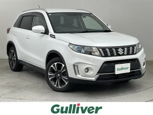 スズキ エスクード 1．4 ターボ 道央・札幌 2019(平31)年 3.9万km クールホワイトパール ・ワンオーナー/・４WD/・寒冷地仕様/・社外メモリナビ/・バックカメラ/・CD／DVDフルセグ／Bluetooth/・社外ETC/・純正ドライブレコーダー/・純正エンジンスターター/・デュアルカメラブレーキサポート/・アダプティブクルーズコントロール/・ヒルディセントコントロール/・レーンキープアシズト/・盗難防止装置/・横滑り防止装置/・前席シートヒーター/・ハーフレザーシート/・純正フロアマット/・LEDヘッドライト/・フォグランプ/・純正AW17インチ/・積込スタッドレスタイヤ純正AW17インチ/・スマートキー/・プッシュスタート/・取扱説明書/・保証書