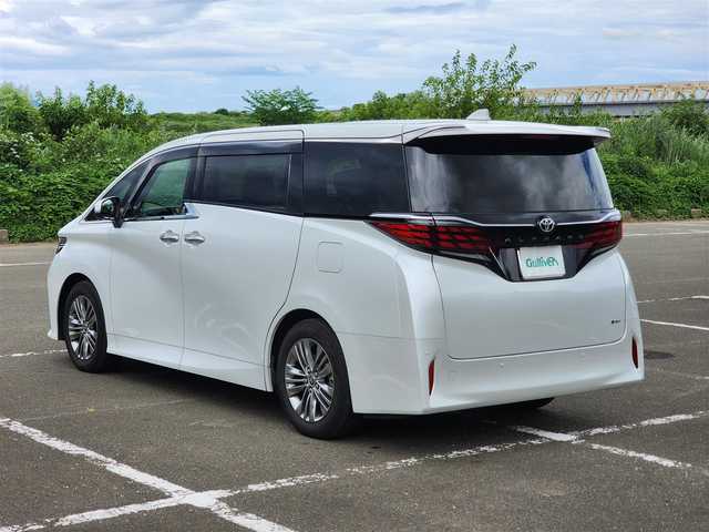 トヨタ アルファードハイブリット Z 福岡県 2025(令7)年 0.6万km パール ワンオーナー/純正ナビ・フルセグTV/（Bluetooth・HDMI）/純正13.2フリップダウンモニター/左右独立ムーンルーフ・パワーサンシェード/セーフティーセンス・パーキングサポートブレーキ/ブラインドスポットモニター/パノラミックビューモニター/デジタルインナーミラー/両側パワースライドドア/パワーバックドア/純正18インチアルミホイール/ブラックレザーシート/（パワーシート・エアシート）/二列目エグゼクティブパワーシート/（エアシート・シートヒーター）/前後ドライブレコーダー/置くだけ充電/新車時保証書/取扱説明書