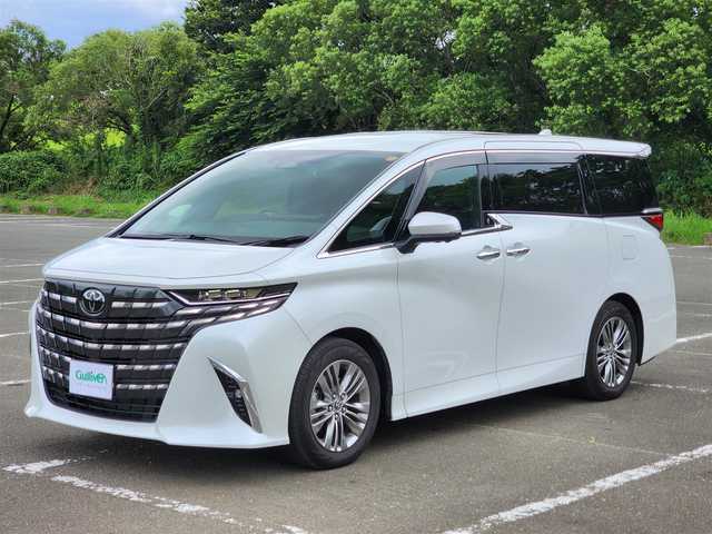 トヨタ アルファードハイブリット Z 福岡県 2025(令7)年 0.6万km パール ワンオーナー/純正ナビ・フルセグTV/（Bluetooth・HDMI）/純正13.2フリップダウンモニター/左右独立ムーンルーフ・パワーサンシェード/セーフティーセンス・パーキングサポートブレーキ/ブラインドスポットモニター/パノラミックビューモニター/デジタルインナーミラー/両側パワースライドドア/パワーバックドア/純正18インチアルミホイール/ブラックレザーシート/（パワーシート・エアシート）/二列目エグゼクティブパワーシート/（エアシート・シートヒーター）/前後ドライブレコーダー/置くだけ充電/新車時保証書/取扱説明書