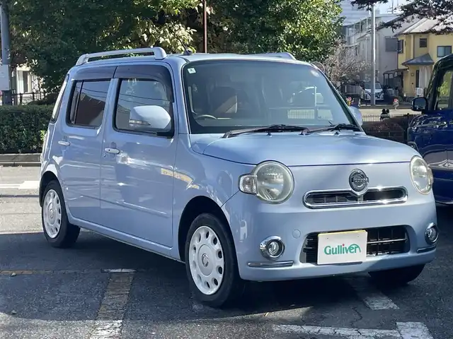 ダイハツ ミラ ココア プラスX スペシャルコーデ 神奈川県 2014(平26)年 2.7万km ミストブルーマイカメタリック 社外SDナビ/CD/DVD/Bluetooth/ワンセグ/革巻きステアリング/ブラウンスウェード調シート/ルーフレール/スマートキー/電動格納ウインカーミラー/SRSエアバッグ(運転席/助手席)