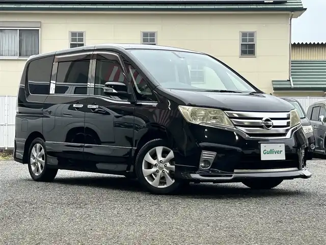 日産 セレナ ハイウェイスター Vセレクション 大阪府 2012(平24)年 9.9万km スーパーブラック 社外SD８インチナビ（VIE-X088V)/CD/DVD/フルセグテレビ/Bluetooth/SD/バックカメラ/フリップダウンモニター10.2インチ（TMX-R2200)/ビルトインETC/両側パワースライドドア/純正AW/社外HIDヘッドランプ/アイドリングストップ/プッシュスタート/スマートキー×２/フロアマット/電動格納ミラー/ドアバイザー/取扱説明書/保証書