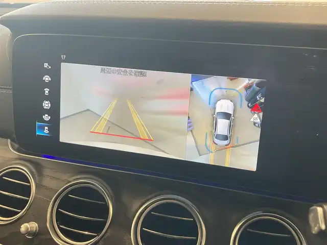 メルセデス・ベンツ Ｅ２００ スポーツ 熊本県 2021(令3)年 2.5万km ダイヤモンドホワイト ・スマートキー/・プッシュスタート/・パノラマサンルーフ /・アクティブステアリングアシスト/・道路標識アシスト/・アクティブレーンキーピングアシスト/・アクティブブレーキアシスト/・アテンションアシスト/・信号表示/・ブラインドスポットモニター/・クルーズコントロール(追従式)/・レーンチェンジアシスト/・インテリジェントライトシステム/・黒革シート/・前席パワーシート/・全席シートヒーター /・純正HDDナビ/　【Bluetooth・USB・AppleCarPlay・AndroidAuto】/・Burmesterサウンドシステム/・フルセグTV/・全方位カメラ/・ETC2.0/・ヘッドアップディスピレイ/・パワートランク/・LEDヘッドランプ/・純正マット/・保証書/取説