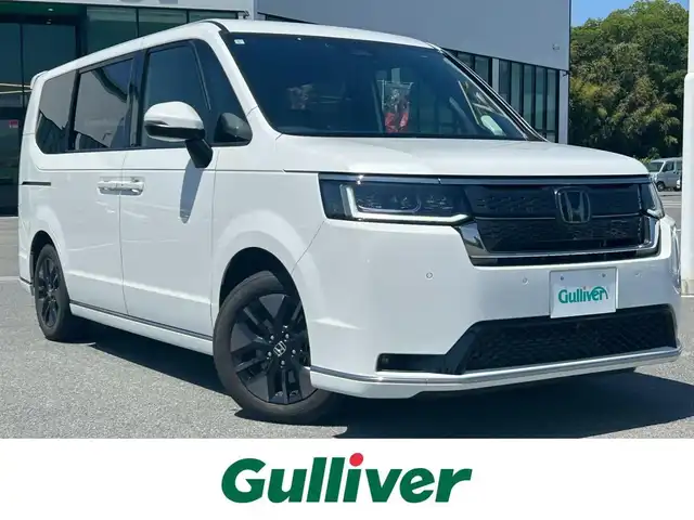ホンダ ステップワゴン スパーダ 奈良県 2023(令5)年 2.1万km プラチナホワイトパール 純正１１．４型コネクトナビ　/フルセグ/DVD/Ｂｌｕｅｔｏｏｔｈ　/ビルトインETC/バックカメラ　/追従型クルーズコントロール　/両側パワースライドドア/パワーバックドア　/ハーフレザーシート　/前席シートヒーター　/2列目オットマン　/社外フロアマット/純正アルミホイール/オートLEDライト/オートハイビーム/衝突被害軽減ブレーキ/横滑り防止装置/レーンキープアシスト/W+サイド+カーテンエアバッグ/スペアキー1本