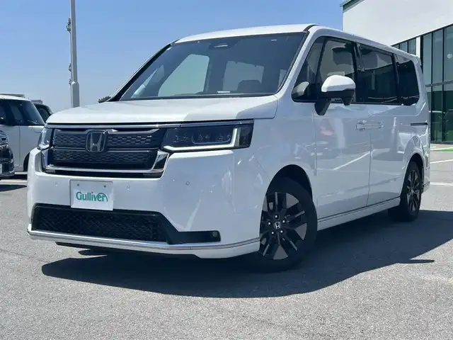 ホンダ ステップワゴン スパーダ 奈良県 2023(令5)年 2.1万km プラチナホワイトパール 純正１１．４型コネクトナビ　/フルセグ/DVD/Ｂｌｕｅｔｏｏｔｈ　/ビルトインETC/バックカメラ　/追従型クルーズコントロール　/両側パワースライドドア/パワーバックドア　/ハーフレザーシート　/前席シートヒーター　/2列目オットマン　/社外フロアマット/純正アルミホイール/オートLEDライト/オートハイビーム/衝突被害軽減ブレーキ/横滑り防止装置/レーンキープアシスト/W+サイド+カーテンエアバッグ/スペアキー1本