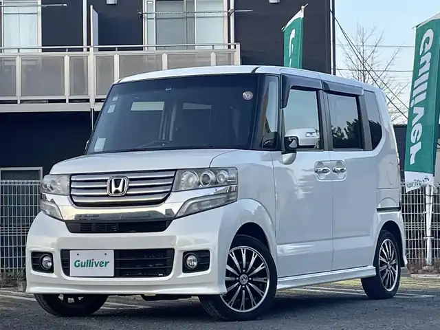 ホンダ Ｎ ＢＯＸ カスタム G ターボSSパッケージ 宮城県 2013(平25)年 9.7万km プレミアムホワイトパール 純正ナビ/フルセグＴＶ/ＡＭ／ＦＭ／ＣＤ／ＤＶＤ／ＵＳＢ／Ｂｌｕｅｔｏｏｔｈ/クルーズコントロール/横滑り防止装置/オートライト（ＬＥＤ）/純正フロアマット/純正ドアバイザー/スペアキー×１/エンジンスターター/両側パワースライドドア