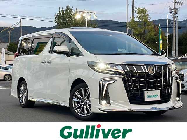 トヨタ アルファード S タイプゴールドⅢ 長野県 2023(令5)年 2.7万km ホワイトパールクリスタルシャイン 純正９型ナビ機能付きディスプレイオーディオ(AM/FM/BT/TV/DVD/USB/AppleCarPlay)/純正モデリスタフルエアロ/シグネチャーイルミブレード/ツインムーンルーフ/フルセグTV/純正ビルトインETC/バックカメラ/両側電動スライドドア/電動パワーバックドア/寒冷地仕様/AC100Vアクセサリーコンセント/後列オットマン/追従型クルーズコントロール/Kranzeホイール夏タイヤ車載(245/40/R19)/シーケンシャルターンランプ/三眼LEDヘッドライト/オートライト/アダプティブハイビーム/アダプティブフロントライティングシステム/フォグランプ/純正フロアマット/純正18インチアルミホイール/ハーフレザーシート/電子パーキング　オートホールド/革巻きステアリング/ステアリングスイッチ/トヨタセーフティセンス/プリクラッシュセーフティ/ロードサインアシスト/レーントレーシングアシスト/ブラインドスポットモニター/パーキングサポートブレーキ/リヤクロストラフィックアラート/先行車発進告知/前後クリアランスソナー/スマートキー/スペアキー/ＭＴモード付ＡＴ