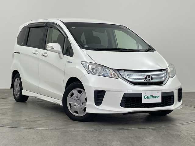 ホンダ フリード ハイブリット ジャストセレクション 群馬県 2013(平25)年 7万km ホワイトオーキッドパール 純正９型後席モニター　純正７型ナビ　バックカメラ　両側電動スライドドア　クルーズコントロール　ハーフレザーシート　ＥＴＣ　ＨＩＤヘッドライト　オートライト　革巻きステアリング　スマートキー　禁煙車