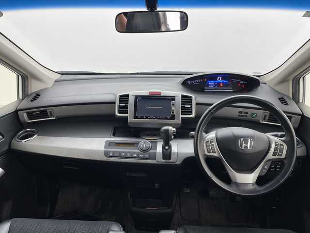 ホンダ フリード ハイブリット ジャストセレクション 群馬県 2013(平25)年 7万km ホワイトオーキッドパール 純正９型後席モニター　純正７型ナビ　バックカメラ　両側電動スライドドア　クルーズコントロール　ハーフレザーシート　ＥＴＣ　ＨＩＤヘッドライト　オートライト　革巻きステアリング　スマートキー　禁煙車