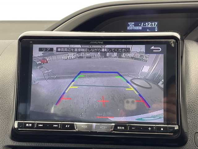 トヨタ ヴォクシー ZS 煌Ⅱ 栃木県 2016(平28)年 10.7万km ブラッキッシュアゲハガラスフレーク アルパイン製ナビ/　（CD/DVD/フルセグTV/Bluetooth）/バックカメラ/アルパインフリップダウンモニター/トヨタセーフティセンス/・プリクラッシュセーフティ/・レーンディパーチャーアラート/・オートハイビームアシスト/ビルトインETC/両側パワースライドドア/LEDヘッドライト/フロントフォグ/スマートキー/プッシュスタート/アイドリングストップ/ステアリングスイッチ/純正フロアマット
