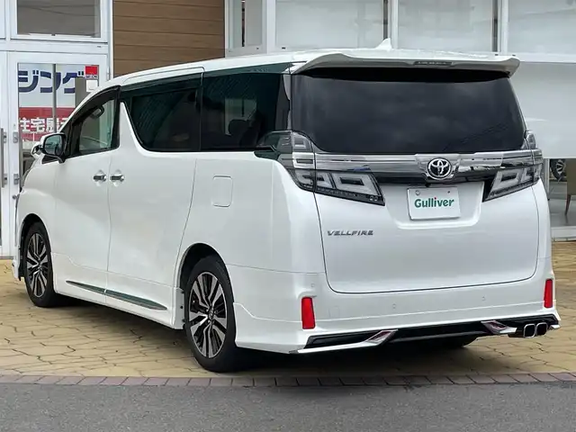 トヨタ ヴェルファイア Z Gエディション 宮崎県 2018(平30)年 4.5万km ホワイトパールクリスタルシャイン 〇純正１０インチナビ/〇フルセグTV/〇バックカメラ/〇フリップダウンモニター/〇ビルトインETC2.0/〇前後ドラレコ/〇モデリスタエアロ/〇パワースライドドア（両側）/〇パワーバックドア/〇ツインムーンルーフ/〇セーフティセンス/〇インテリジェントクリアランスソナー/〇前席シートヒーター/パワーシート/〇2列目エグゼクティブパワーシート/〇シートヒーター/シートベンチレーション/〇革巻きステアリングホイール/〇ステアリングヒーター/〇スマートエントリー/〇純正18インチAW/〇禁煙車