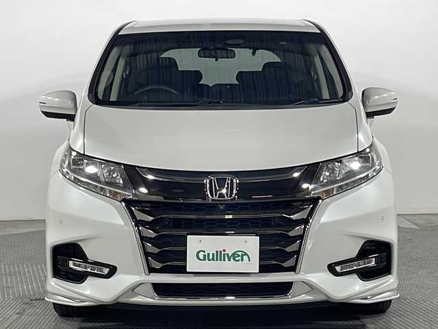 ホンダ オデッセイ ハイブリッド アブソルート・EXホンダセンジング 広島県 2020(令2)年 4.1万km プラチナホワイトパール 純正9型ナビ/純正フリップダウンモニター/マルチビューカメラ/両側パワースライドドア/パワーシート/シートヒーター/2列目オットマン/ホンダセンシング/・衝突軽減ブレーキ/・レーンキープアシスト/・アダプティブクルーズコントロール/・誤発進抑制機能/スマートパーキングアシスト/ブラインドスポットモニター/後退出庫サポート/電動パーキングブレーキ/オートブレーキホールド/LEDヘッドランプ/純正17インチAW/ETC2.0/ドライブレコーダー/AC100V/1500W電源