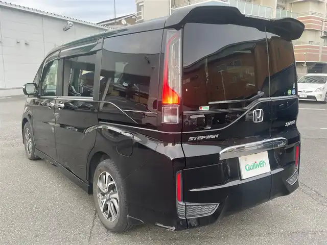 ホンダ ステップワゴン スパーダ ホンダセンシング 静岡県 2017(平29)年 6.5万km プレミアムスパークルブラックパール ワンオーナー/ホンダセンシング/・CMBS（衝突軽減ブレーキ）/・アダプティブクルーズコントロール/・LKAS（車線維持支援システム）/・先行発進お知らせ機能/・標識認識機能/・路外逸脱抑制機能/純正メモリナビ/・フルセグ/Bluetooth/SD/DVD/CD/バックカメラ/両側パワースライドドア/スマートキー2個/プッシュスタート/２列目サンシェード/ステアリングリモコン/オートライト/ETC/純正１６インチAW/純正フロアマット/新車時保証書/取扱説明書