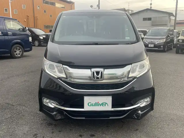 ホンダ ステップワゴン スパーダ ホンダセンシング 静岡県 2017(平29)年 6.5万km プレミアムスパークルブラックパール ワンオーナー/ホンダセンシング/・CMBS（衝突軽減ブレーキ）/・アダプティブクルーズコントロール/・LKAS（車線維持支援システム）/・先行発進お知らせ機能/・標識認識機能/・路外逸脱抑制機能/純正メモリナビ/・フルセグ/Bluetooth/SD/DVD/CD/バックカメラ/両側パワースライドドア/スマートキー2個/プッシュスタート/２列目サンシェード/ステアリングリモコン/オートライト/ETC/純正１６インチAW/純正フロアマット/新車時保証書/取扱説明書