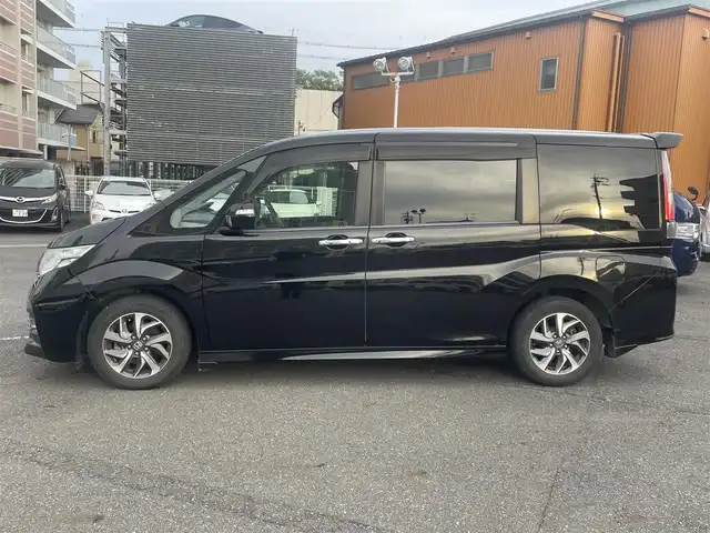 ホンダ ステップワゴン スパーダ ホンダセンシング 静岡県 2017(平29)年 6.5万km プレミアムスパークルブラックパール ワンオーナー/ホンダセンシング/・CMBS（衝突軽減ブレーキ）/・アダプティブクルーズコントロール/・LKAS（車線維持支援システム）/・先行発進お知らせ機能/・標識認識機能/・路外逸脱抑制機能/純正メモリナビ/・フルセグ/Bluetooth/SD/DVD/CD/バックカメラ/両側パワースライドドア/スマートキー2個/プッシュスタート/２列目サンシェード/ステアリングリモコン/オートライト/ETC/純正１６インチAW/純正フロアマット/新車時保証書/取扱説明書