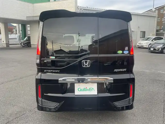 ホンダ ステップワゴン スパーダ ホンダセンシング 静岡県 2017(平29)年 6.5万km プレミアムスパークルブラックパール ワンオーナー/ホンダセンシング/・CMBS（衝突軽減ブレーキ）/・アダプティブクルーズコントロール/・LKAS（車線維持支援システム）/・先行発進お知らせ機能/・標識認識機能/・路外逸脱抑制機能/純正メモリナビ/・フルセグ/Bluetooth/SD/DVD/CD/バックカメラ/両側パワースライドドア/スマートキー2個/プッシュスタート/２列目サンシェード/ステアリングリモコン/オートライト/ETC/純正１６インチAW/純正フロアマット/新車時保証書/取扱説明書