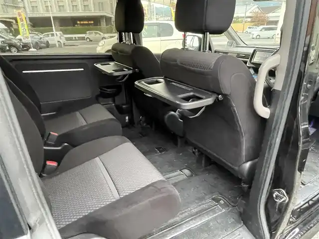 ホンダ ステップワゴン スパーダ ホンダセンシング 静岡県 2017(平29)年 6.5万km プレミアムスパークルブラックパール ワンオーナー/ホンダセンシング/・CMBS（衝突軽減ブレーキ）/・アダプティブクルーズコントロール/・LKAS（車線維持支援システム）/・先行発進お知らせ機能/・標識認識機能/・路外逸脱抑制機能/純正メモリナビ/・フルセグ/Bluetooth/SD/DVD/CD/バックカメラ/両側パワースライドドア/スマートキー2個/プッシュスタート/２列目サンシェード/ステアリングリモコン/オートライト/ETC/純正１６インチAW/純正フロアマット/新車時保証書/取扱説明書