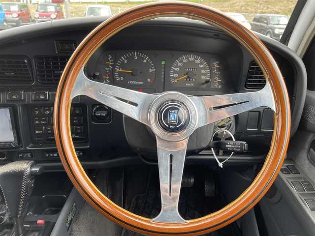 トヨタ ランドクルーザー VX－LTD スペシャルP 岡山県 1994(平6)年 19.8万km ダークグリーンマイカ 社外ナビ/社外ETC/サンルーフ/スペアキー/クルーズコントロール/フルセグTV/純正フロアマット/リフトシート/ドアバイザー/ランバーサポート【D席】/横滑り防止装置