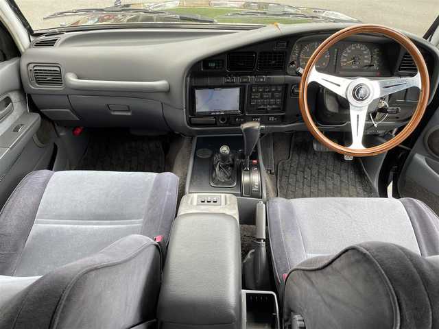 トヨタ ランドクルーザー VX－LTD スペシャルP 岡山県 1994(平6)年 19.8万km ダークグリーンマイカ 社外ナビ/社外ETC/サンルーフ/スペアキー/クルーズコントロール/フルセグTV/純正フロアマット/リフトシート/ドアバイザー/ランバーサポート【D席】/横滑り防止装置