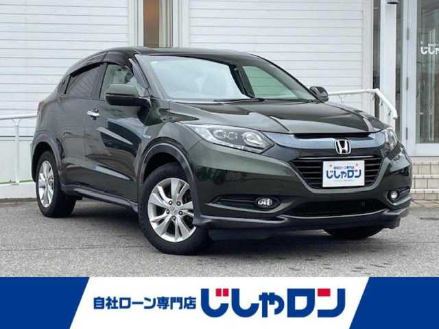ホンダ ヴェゼル ハイブリッド X 富山県 2014(平26)年 10.4万km ミスティックグリーンパール (株)IDOMが運営する【じしゃロン富山店】の自社ローン専用車両になります。こちらは現金またはオートローンご利用時の価格です。自社ローンご希望の方は別途その旨お申し付け下さい/純正ナビ/FM/AM/TV/CD/SD/ETC/バックカメラ/シティブレーキアクティブシステム/横滑り防止/クルーズコントロール/パドルシフト/D・N席シートヒーター/LEDヘッドライト/オートライト/フォグランプ/プッシュスタート/スマートキー/取説/保証書/記録簿