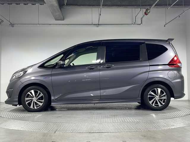 ホンダ フリード ハイブリット EX 神奈川県 2016(平28)年 7.1万km モダンスティールM 両側電動スライドドア【サンシェード】/ホンダセンシング/衝突軽減ブレーキ/歩行者事故低減ステアリング/アダブティブクルーズコントロール/車線維持支援システム/路外逸脱抑制機能/誤発進抑制機能/先行車発進告知お知らせ/標識認識機能/社外コンビステアリング/ハーフレザーシート/前席シートヒーター/プッシュスタート/ビルトインETC/スマートキー/純正15インチアルミホイール/純正サイドシル　リアスポイラー/LEDヘッドランプ/オートライト/アクティブコーナリングランプ