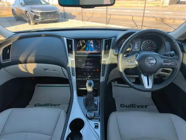 日産 スカイライン GT タイプSP 愛知県 2020(令2)年 1.8万km ダークメタルグレー ワンオーナー/純正8型ナビ/フルセグTV/アラウンドビューモニター/ビルトインETC2.0/ドライブレコーダー/レーダークルーズコントロール/フロント/バックソナー/全方位運転支援システム/・エマージェンシーブレーキ/・車線逸脱防止支援システム/・踏み間違い衝突防止アシスト/・後側方衝突防止支援システム/・後側方車両検知警報/ツインターボ/ステアリング連動LEDヘッドランプ/LEDフロントフォグランプ/革巻きステアリング/パドルシフト/ベージュ革シート/前席パワーシート/シートヒーター/純正19インチアルミホイール/ローダウン/HKS車高調/スマートキー/プッシュエンジンスターター/禁煙車