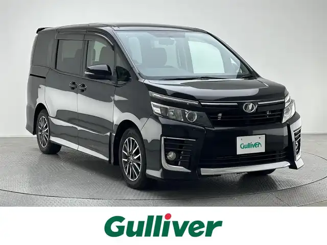 トヨタ ヴォクシー ZS 兵庫県 2014(平26)年 8万km ブラック プッシュスタート/社外ナビ/（CD・DVD・フルセグTV・BTオーディオ・SD）/バックカメラ/ETC/社外フリップダウンモニター/純正16インチAW/片側パワースライドドア/HIDヘッドライト/オートライト/フォグライト/社外ホーン/横滑り防止装置/ウィンカーミラー/新車保証書/取扱説明書/スマートスペアキー×1本
