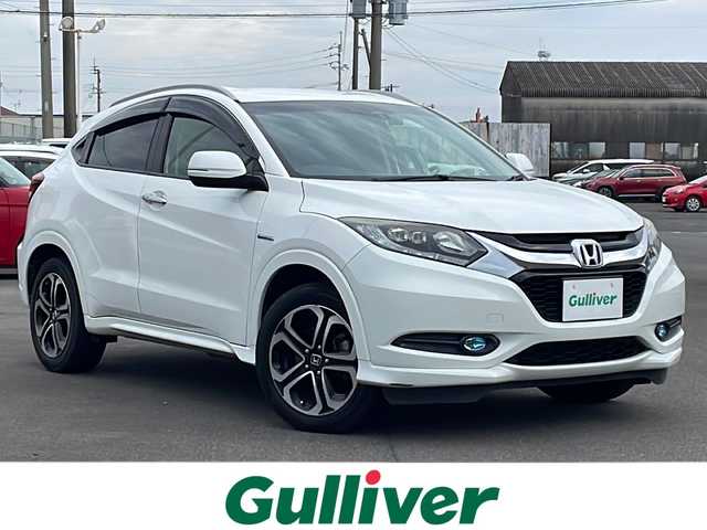 ホンダ ヴェゼル ハイブリッド Z 鹿児島県 2015(平27)年 10.3万km ホワイトオーキッドパール インターナビ/フルセグ/バックカメラ/Bluetooth/ビルトインETC/ステアリングスイッチ/前席シートヒーター/前方ドライブレコーダー/パドルシフト/クルーズコントロール/衝突軽減ブレーキ/トノカバー/スマートキー2本/純正フロアマット/LEDヘッドライト/フロントフォグランプ/オートライト