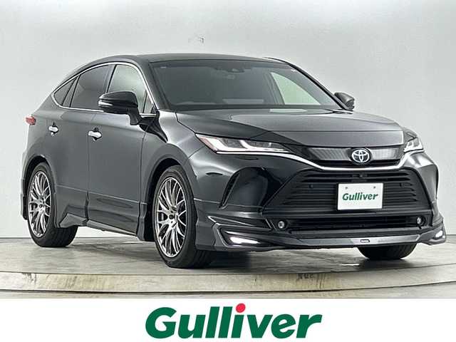 トヨタ ハリアー ハイブリッド Z レザーパッケージ 愛知県 2020(令2)年 5.8万km プレシャスブラックパール 禁煙車/モデリスタエアロ/純正12.3インチナビ/(Bluetooth/AUX/USB/FM/AM/フルセグTV/AppleCarPlay/AndoirdAuto)/JBLサウンド/全方位カメラ/(バックカメラ/フロントカメラ/両サイドカメラ)/ヘッドアップディスプレイ/トヨタセーフティセンス/・アダプティブクルーズコントロール/・プリクラッシュセーフティ/・レーンキープアシスト/・ブラインドスポットモニター/・オートマチックハイビーム/・ロードサインアシスト/・リアクロストラフィックアラート/・パーキングサポートブレーキ/電動パーキングブレーキ/ブレーキホールド/デジタルインナーミラー/(ドライブレコーダー付き)/ビルトインETC2.0/ステアリングヒーター/ステアリングリモコン/レザーシート/前席パワーシート/前席シートヒーター/前席エアーシート/RAYS製20インチアルミホイール/スマートキー/(スペアキー1本)/プッシュスタート/LEDヘッドライト/オートライト/フロントフォグライト/純正フロアマット