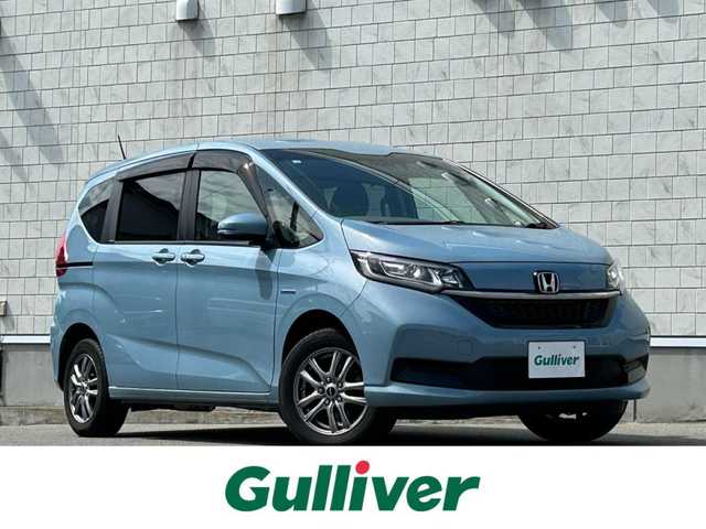 ホンダ フリード ハイブリット G ホンダセンシング 山形県 2020(令2)年 5.7万km シーグラスブルーパール ４WD/SDナビ/フルセグTV/AM/FM/iPod/USB/SD/Bluetooth/クルーズコントロール/ホンダセンシング/両側パワースライドドア/衝突軽減ブレーキ/横滑り防止装置/シートヒーター/ドライブレコーダー/バックカメラ/盗難防止装置/ダブルエアバック/純正マット/純正バイザー/AUTOライト/LEDライト/スマートキー/保証書
