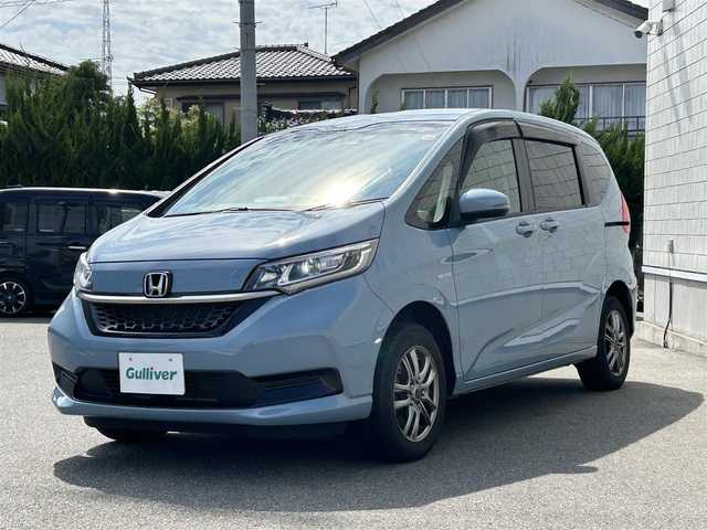 ホンダ フリード ハイブリット G ホンダセンシング 山形県 2020(令2)年 5.7万km シーグラスブルーパール ４WD/SDナビ/フルセグTV/AM/FM/iPod/USB/SD/Bluetooth/クルーズコントロール/ホンダセンシング/両側パワースライドドア/衝突軽減ブレーキ/横滑り防止装置/シートヒーター/ドライブレコーダー/バックカメラ/盗難防止装置/ダブルエアバック/純正マット/純正バイザー/AUTOライト/LEDライト/スマートキー/保証書