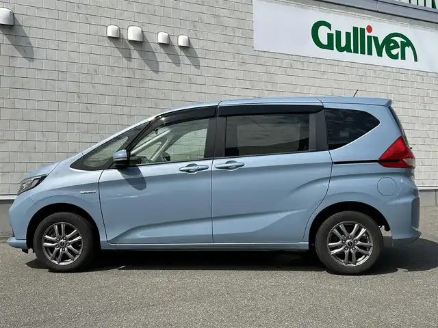 ホンダ フリード ハイブリット G ホンダセンシング 山形県 2020(令2)年 5.7万km シーグラスブルーパール ４WD/SDナビ/フルセグTV/AM/FM/iPod/USB/SD/Bluetooth/クルーズコントロール/ホンダセンシング/両側パワースライドドア/衝突軽減ブレーキ/横滑り防止装置/シートヒーター/ドライブレコーダー/バックカメラ/盗難防止装置/ダブルエアバック/純正マット/純正バイザー/AUTOライト/LEDライト/スマートキー/保証書