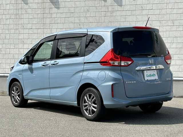 ホンダ フリード ハイブリット G ホンダセンシング 山形県 2020(令2)年 5.7万km シーグラスブルーパール ４WD/SDナビ/フルセグTV/AM/FM/iPod/USB/SD/Bluetooth/クルーズコントロール/ホンダセンシング/両側パワースライドドア/衝突軽減ブレーキ/横滑り防止装置/シートヒーター/ドライブレコーダー/バックカメラ/盗難防止装置/ダブルエアバック/純正マット/純正バイザー/AUTOライト/LEDライト/スマートキー/保証書