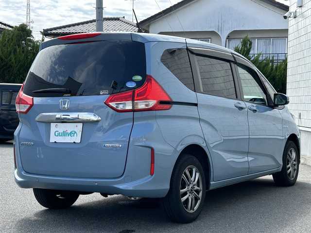 ホンダ フリード ハイブリット G ホンダセンシング 山形県 2020(令2)年 5.7万km シーグラスブルーパール ４WD/SDナビ/フルセグTV/AM/FM/iPod/USB/SD/Bluetooth/クルーズコントロール/ホンダセンシング/両側パワースライドドア/衝突軽減ブレーキ/横滑り防止装置/シートヒーター/ドライブレコーダー/バックカメラ/盗難防止装置/ダブルエアバック/純正マット/純正バイザー/AUTOライト/LEDライト/スマートキー/保証書