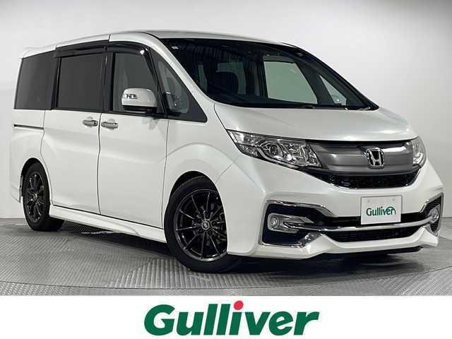 ホンダ ステップワゴン スパーダ ホンダセンシング 広島県 2017(平29)年 4.1万km ホワイトオーキッドパール 禁煙/社外ナビ/後席モニター/バックカメラ/レーダークルーズコントロール/両側パワースライドドア/レーンキープアシスト/オートライト/踏み間違い防止/ビルトインＥＴＣ２．０/スペアキー/パドルシフト