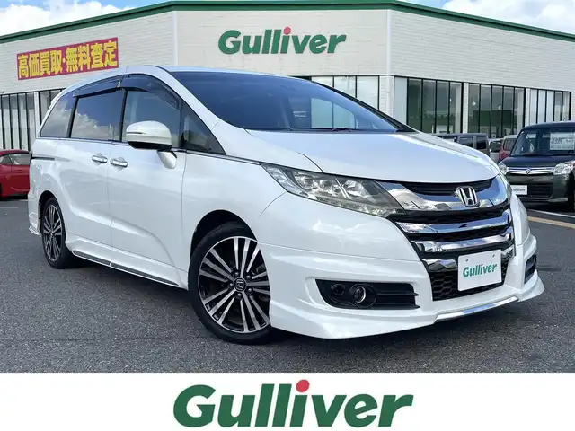 ホンダ オデッセイ アブソルート EX 鳥取県 2013(平25)年 9.1万km ホワイトオーキッドパール 純正ナビ／フルセグ／ＤＶＤＶ／ＣＤ／ＢＴ/バックカメラ/ビルトインＥＴＣ/フリップダウンモニター/（HDMI接続のみ使用可）/衝突軽減ブレーキ/クルーズコントロール/両側パワースライド/ハーフレザーシート/後席オットマンシート/ＬＥＤヘットライト/プッシュエンジンスタート/アイドリングストップ/フロアマット/ドアバイザー