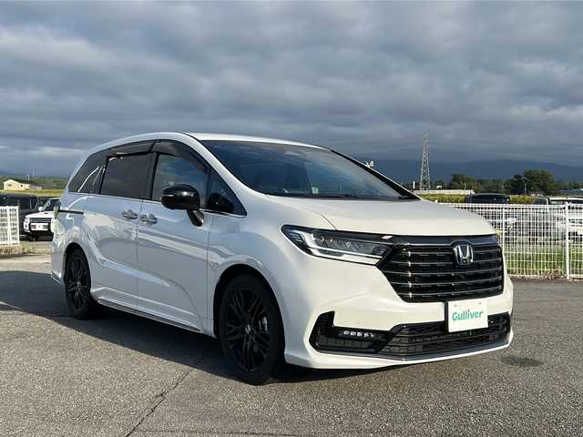 ホンダ オデッセイ ハイブリッド e:HEVアブソルート EXブラックED 富山県 2024(令6)年 0.7万km プラチナホワイトパール 禁煙車/ワンオーナー/純正ＤＡ/純正後席モニター/全方位カメラ/フルセグＴＶ/BlueTooth・CD・DVD/ホンダセンシング/ブラインドスポットモニター/レーダークルーズコントロール/レーンキープアシスト/コーナーセンサー/電動リアドア/両側パワースライド/USB入力端子/ワイヤレス充電/純正アルミホイール/純正フロアマット/ＥＴＣ/ドライブレコーダー/保証書・記録簿/取扱説明書