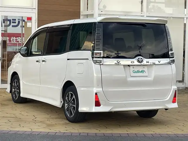 トヨタ ヴォクシー ZS 煌Ⅲ 宮崎県 2021(令3)年 3.8万km ホワイトパールクリスタルシャイン ワンオーナー/ディーラー純正ナビ(NSZN-Z08T)/(BT/AM/FM/CD/DVD)/バックカメラ/フルセグテレビ/スマートキー/ETC/前後ドライブレコーダー/ハーフレザー/両側パワースライドドア/オートマチックハイビーム/プッシュスタート/クルーズコントロール/LEDヘッドライト/アイドリングストップ