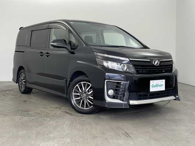 トヨタ ヴォクシー ZS 兵庫県 2015(平27)年 7.6万km ブラック ・純正ナビ/CD/DVD/TV/SD/Bluetooth/・バックカメラ/・ビルトインETC/・左側パワースライドドア/・アイドリングストップ/・ＬＥＤヘッドライト/・オートライト/・フォグランプ/・革巻きステアリング/・プッシュスタート/・スマートキー/・純正フロアマット/・純正16インチアルミホイール