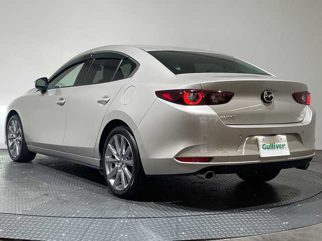 マツダ マツダ３セダン 15S ツーリング 愛媛県 2023(令5)年 3.4万km プラチナクォーツメタリック 純正8.8インチナビ/Bluetooth/フルセグ/USB/全周囲カメラ/レーダークルーズコントロール/衝突被害軽減ブレーキ/レーンキープアシスト/前後コーナーセンサー/ブラインドスポットモニター/LEDヘッドライト/オートマチックハイビーム/オートライト/ドライブレコーダー/ETC/電動格納ミラー/センターコンソール/純正18インチアルミ/純正フロアマット