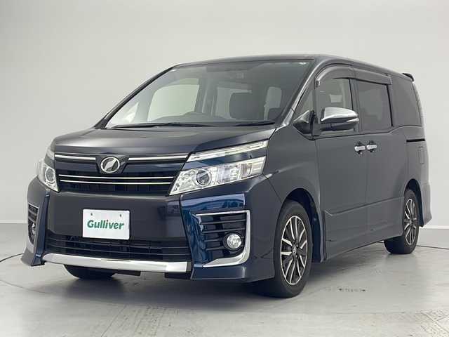 トヨタ ヴォクシー ZS 煌 茨城県 2015(平27)年 6.9万km ブラッキッシュアゲハガラスフレーク 純正８インチナビ　/後席モニター　/両側電動スライドドア　/バックカメラ　/ビルドインＥＴＣ　/ＨＤＭＩ　/ドアバイザー　/ＬＥＤヘッドライト　/フォグライト　/ドライブレコーダー　/純正アルミホイール　/スマートキー